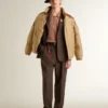 Blouson aviateur beige avec détails en cuir et patchs