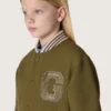 Blouson aviateur unisexe Journey en sergé de nylon vert militaire avec écusson brodé