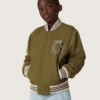 Blouson aviateur unisexe Journey en sergé de nylon vert militaire avec écusson brodé