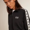 Blue-toned sweatshirt with zipper and white band and contrasting stars