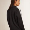 Blue-toned sweatshirt with zipper and white band and contrasting stars