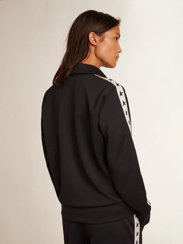 Blue-toned sweatshirt with zipper and white band and contrasting stars