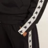 Blue-toned sweatshirt with zipper and white band and contrasting stars