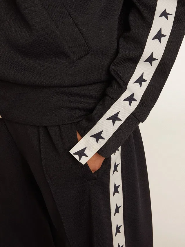 Blue-toned sweatshirt with zipper and white band and contrasting stars