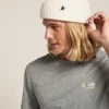 Bonnet en laine blanc avec étoile noire