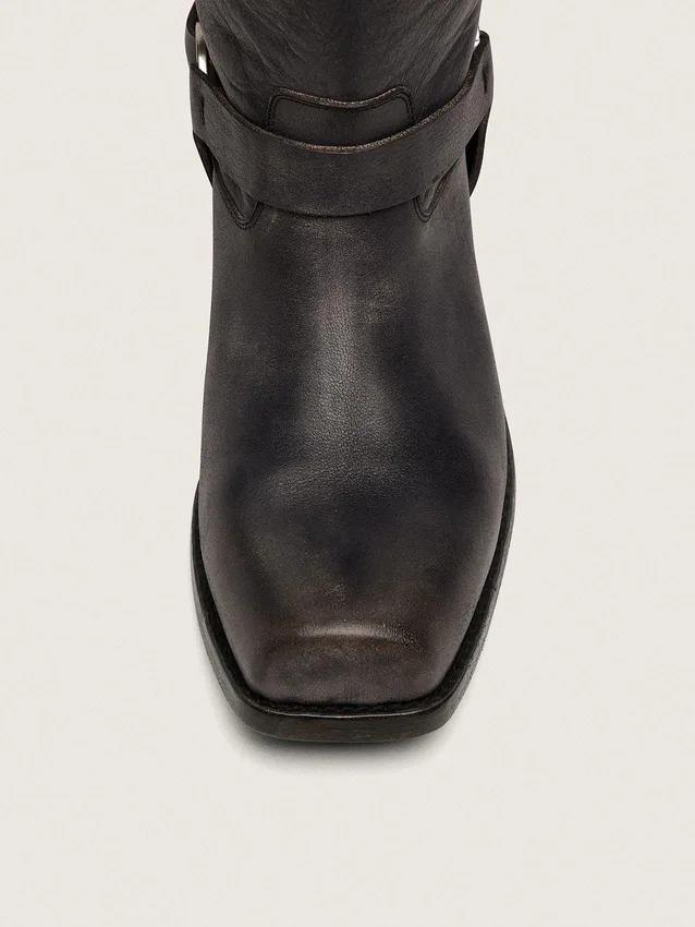 Bottes motardes hautes pour femme en cuir noir avec bride et boucle argentée