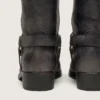 Bottes motardes hautes pour femme en cuir noir avec bride et boucle argentée