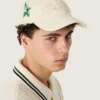Casquette de baseball crème avec écusson « Golden » ton sur ton et pin's en forme d'étoile verte