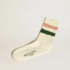 Chaussettes blanc délavé avec détails vieillis et rayures roses et vertes