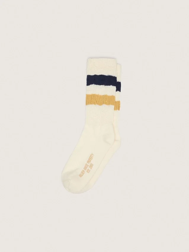Chaussettes blanc vieilli avec détails usés et rayures bicolores
