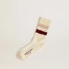 Chaussettes blanches délavées avec détails vieillis et rayures beiges et bordeaux