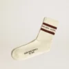 Chaussettes blanches délavées avec détails vieillis et rayures marron