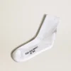 Chaussettes blanches ornées d’une étoile en cristal à l’arrière