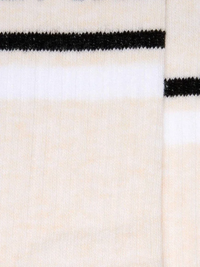 Chaussettes couleur blush avec détails vieillis et rayures noires et blanches