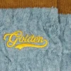 Chaussettes côtelées bleu clair avec détails marron et logo jaune