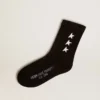 Chaussettes noires ornées d’étoiles blanches contrastantes