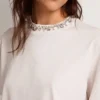 Chemise blanche pour femme ornée de cristaux cabochons