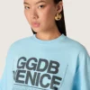 Chemise court pour femme en jersey de coton bleu clair avec imprimé graphique