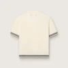 Chemise en maille blanche pour femme avec bords contrastés et broche amovible