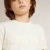 Chemise pour garçon de couleur crème avec logo en relief