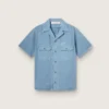 Chemise unisexe en denim bleu clair avec broderie dans le dos