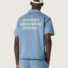 Chemise unisexe en denim bleu clair avec broderie dans le dos