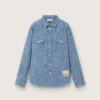 Chemise unisexe Journey en chambray de coton bleu clair avec ourlet frangé et écusson brodé