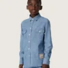 Chemise unisexe Journey en chambray de coton bleu clair avec ourlet frangé et écusson brodé
