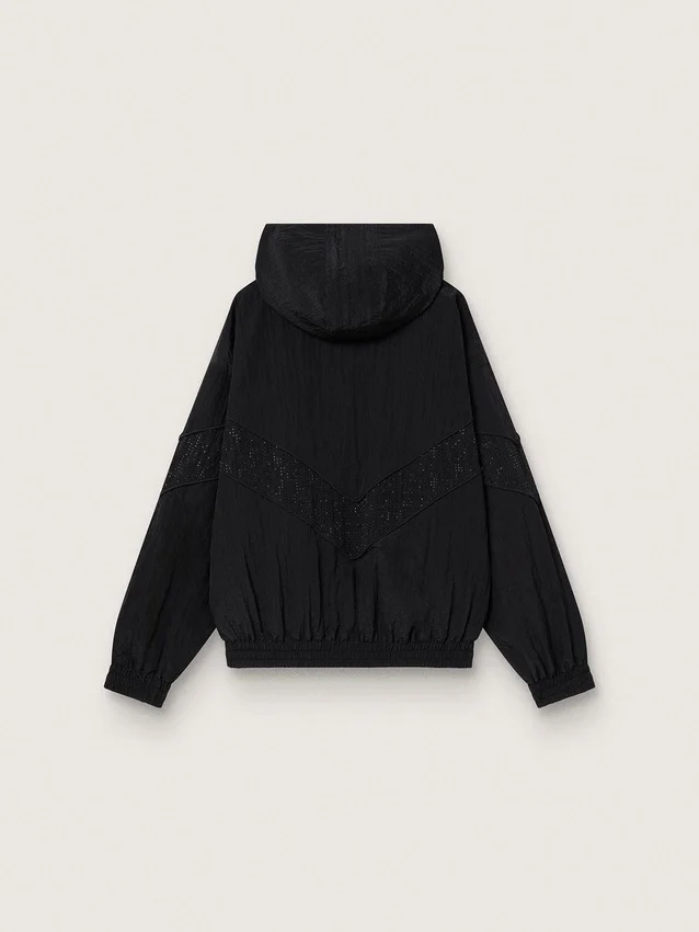 Coupe-vent pour femme en nylon noir orné de cristaux ton sur ton