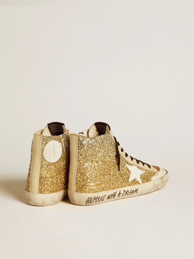 Francy Penstar en paillettes dorées avec une étoile en cuir blanc