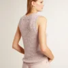 Haut en maille ajourée avec paillettes et détails contrastés