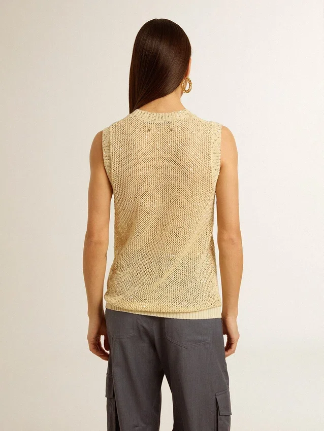 Haut en maille ajourée avec paillettes et détails contrastés
