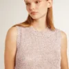 Haut en maille ajourée avec paillettes et détails contrastés