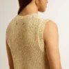 Haut en maille ajourée avec paillettes et détails contrastés