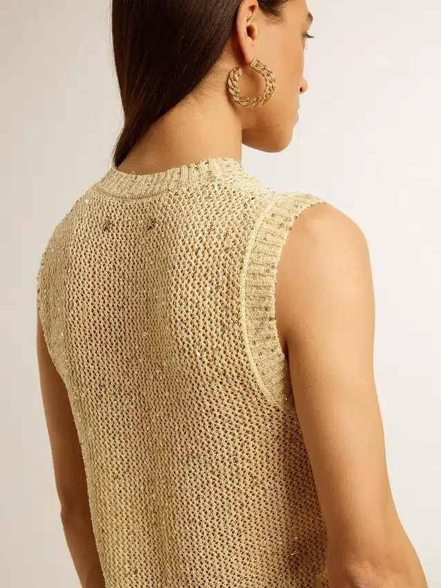 Haut en maille ajourée avec paillettes et détails contrastés