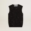 Haut en maille noire avec paillettes et détails contrastés