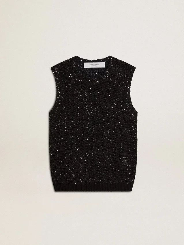 Haut en maille noire avec paillettes et détails contrastés