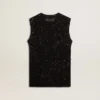 Haut en maille noire avec paillettes et détails contrastés