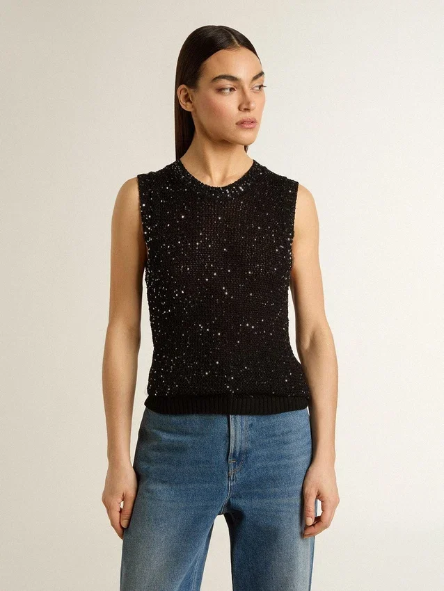 Haut en maille noire avec paillettes et détails contrastés