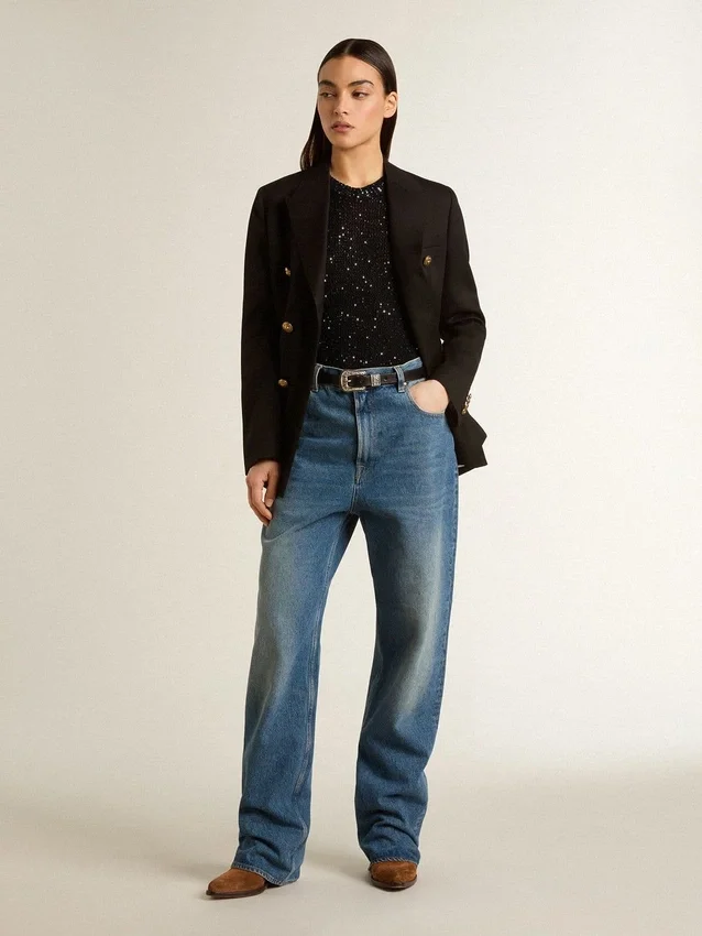 Haut en maille noire avec paillettes et détails contrastés