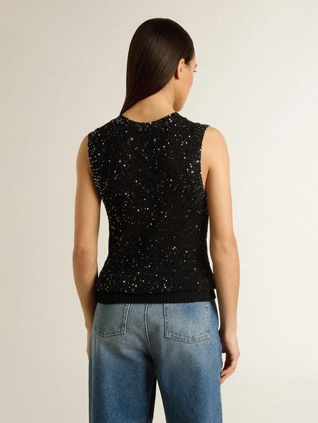 Haut en maille noire avec paillettes et détails contrastés