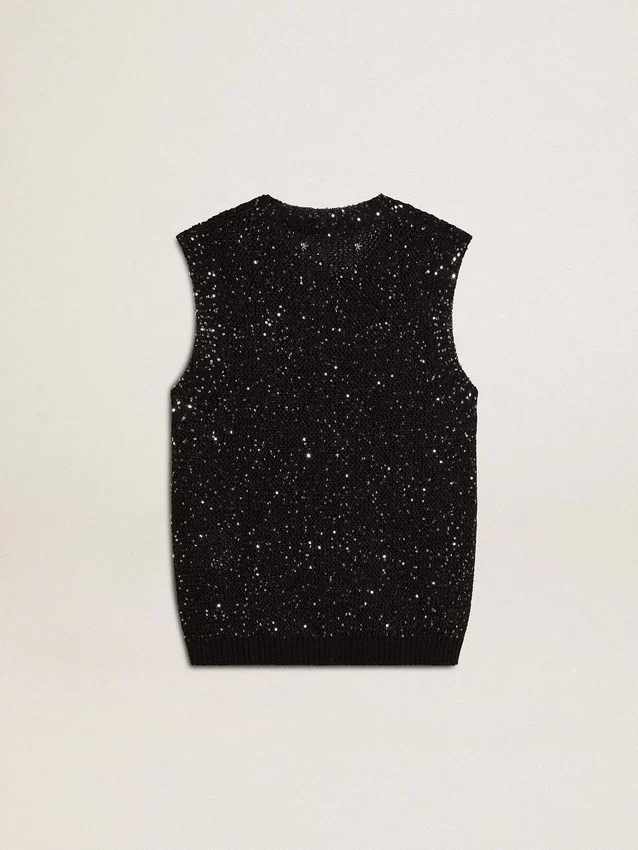 Haut en maille noire avec paillettes et détails contrastés