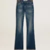 Jean bootcut pour femme au délavage vintage et aux détails métalliques