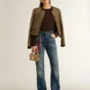 Jean bootcut pour femme au délavage vintage et aux détails métalliques