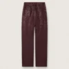Jean pour femme en denim bordeaux orné de cristaux dégradés