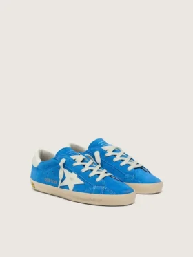 Jeune Super-Star en daim bleu vif avec une étoile en cuir blanc