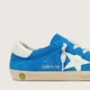 Jeune Super-Star en daim bleu vif avec une étoile en cuir blanc