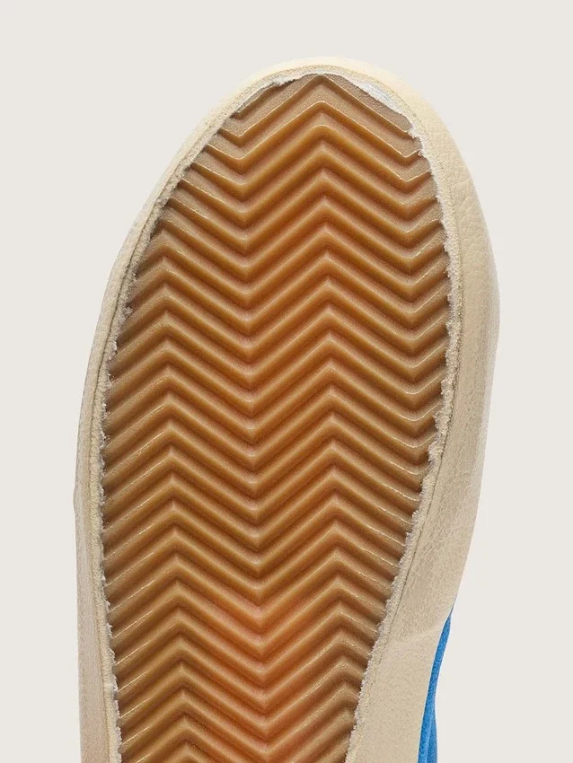 Jeune Super-Star en daim bleu vif avec une étoile en cuir blanc