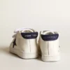 June Junior en nappa avec étoile et languette de talon en daim bleu foncé