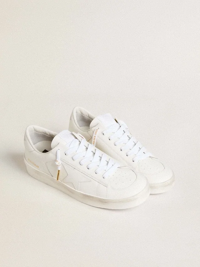 Lacets en coton blanc avec logo doré contrastant